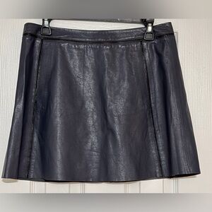 Vintage leather skirt from Bergdorf Goodman in dark blue with two pockets.